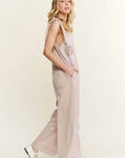 Mineral Washed Flower patched Bow spring jumpsuits - Next Generation Boutique